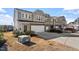 Attractive two-story home with a well-manicured lawn and a spacious driveway with a parked car at 110 Cambria Ln, Morrisville, NC 27560