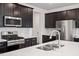 Close-up of kitchen with stainless steel appliances, subway tile backsplash, and quartz countertops at 110 Cambria Ln, Morrisville, NC 27560