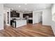 Spacious kitchen with modern appliances, a center island, and hardwood flooring at 110 Cambria Ln, Morrisville, NC 27560