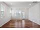 Spacious living room with plenty of natural light and wood flooring at 110 Cambria Ln, Morrisville, NC 27560