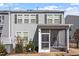 View of rear exterior featuring a screened in porch and lawn at 110 Cambria Ln, Morrisville, NC 27560