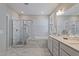 Bright bathroom features marble floors, a glass-enclosed shower, and a soaking tub at 1112 Leatherstone Ln, Fuquay Varina, NC 27526