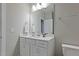 Bathroom with a white vanity, countertop, and a large mirror above the sink at 1112 Leatherstone Ln, Fuquay Varina, NC 27526