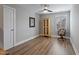 Inviting bedroom with a ceiling fan, wood-look floors, and neutral paint at 1112 Leatherstone Ln, Fuquay Varina, NC 27526
