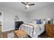 Bedroom featuring a ceiling fan, a patterned quilt, and a trunk at the foot of the bed at 1112 Leatherstone Ln, Fuquay Varina, NC 27526