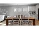 A dining area featuring hardwood floors and an open concept to the kitchen at 1112 Leatherstone Ln, Fuquay Varina, NC 27526