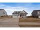 Charming single-Gathering home with a two car garage, manicured lawn, and a welcoming red front door at 1112 Leatherstone Ln, Fuquay Varina, NC 27526