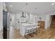 A spacious kitchen island featuring stainless appliances and room to eat and gather at 1112 Leatherstone Ln, Fuquay Varina, NC 27526