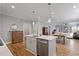 A spacious kitchen island featuring stainless appliances and room to eat and gather at 1112 Leatherstone Ln, Fuquay Varina, NC 27526