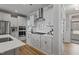 A bright kitchen features white cabinets, stainless steel appliances and a gas cooktop at 1112 Leatherstone Ln, Fuquay Varina, NC 27526