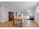 An open living area featuring a dining table and a fireplace at 1112 Leatherstone Ln, Fuquay Varina, NC 27526