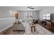 Inviting living room with stylish furniture, hardwood floors and natural light at 1112 Leatherstone Ln, Fuquay Varina, NC 27526