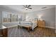 Bright main bedroom with natural light, plantation shutters, and comfortable furnishings at 1112 Leatherstone Ln, Fuquay Varina, NC 27526
