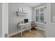 Cozy home office with hardwood floors, shuttered windows, and a vintage desk at 1112 Leatherstone Ln, Fuquay Varina, NC 27526