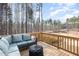 Spacious back deck with outdoor seating overlooking a scenic view at 1154 Romeria Dr, Durham, NC 27713