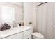 Well-lit bathroom with modern fixtures, a sleek vanity, and a stylish shower curtain at 1154 Romeria Dr, Durham, NC 27713
