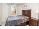 Cozy bedroom with a warm aesthetic, floral decoration, and a window providing ample natural light at 1154 Romeria Dr, Durham, NC 27713