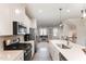 Open kitchen design with an island and stainless steel appliances at 1154 Romeria Dr, Durham, NC 27713