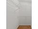 Large walk-in closet with hardwood floors and wire shelving units at 118 N Drawbridge Ln, Cary, NC 27513