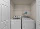Laundry room featuring a side by side washer and dryer and white wire rack for storage at 118 N Drawbridge Ln, Cary, NC 27513