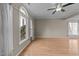 Spacious living room with hardwood floors, large windows offering plenty of natural light at 118 N Drawbridge Ln, Cary, NC 27513