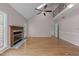 Living room boasts natural light, fireplace, vaulted ceiling, and hardwood floors at 118 N Drawbridge Ln, Cary, NC 27513