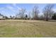 Large backyard with trees and grass at 126 Claire Dr, Clayton, NC 27520