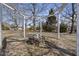 Backyard fire pit with stone features and pergola at 126 Claire Dr, Clayton, NC 27520