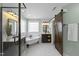Modern bathroom featuring a clawfoot tub, glass shower, and rustic vanity at 126 Claire Dr, Clayton, NC 27520