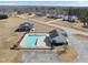 Aerial view of a community pool and surrounding amenity area, highlighting the pool house at 126 Claire Dr, Clayton, NC 27520