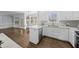 Bright kitchen with white cabinets, stainless steel appliances, and hardwood floors at 126 Claire Dr, Clayton, NC 27520