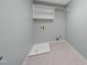 Laundry room with shelving, hookups and vinyl flooring at 126 Claire Dr, Clayton, NC 27520