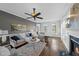 Inviting living room with fireplace, plush seating, ceiling fan, and abundant natural light at 126 Claire Dr, Clayton, NC 27520