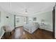 Spacious main bedroom boasts hardwood floors, tray ceiling, and calming paint at 126 Claire Dr, Clayton, NC 27520