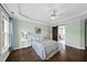 Main bedroom with tray ceiling, ceiling fan, hardwood floors and light walls at 126 Claire Dr, Clayton, NC 27520