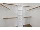 Spacious walk-in closet with built-in shelving and wooden rods at 126 Claire Dr, Clayton, NC 27520