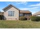 Expansive backyard with lush lawn, mature trees, and a wooden deck at 1324 Vanagrif Ct, Wake Forest, NC 27587