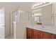 Bathroom featuring a vanity with a sink, a large mirror, and a glass enclosed shower at 1324 Vanagrif Ct, Wake Forest, NC 27587