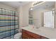Bathroom featuring a vanity with sink, a large mirror, toilet and a shower with striped curtain at 1324 Vanagrif Ct, Wake Forest, NC 27587