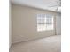 Bedroom features neutral carpet, light walls, large window and ceiling fan at 1324 Vanagrif Ct, Wake Forest, NC 27587