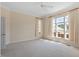 Spacious bedroom with neutral carpet, many windows with curtains and ceiling fan at 1324 Vanagrif Ct, Wake Forest, NC 27587