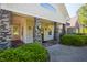 Inviting building entrance with stone columns, featuring a well-maintained walkway and professional landscaping at 1324 Vanagrif Ct, Wake Forest, NC 27587