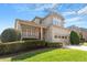 Beautiful home with manicured lawn, brick accents, and a two-car garage at 1324 Vanagrif Ct, Wake Forest, NC 27587