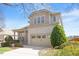 Charming two-story home with manicured landscaping, brick accents, and two-car garage at 1324 Vanagrif Ct, Wake Forest, NC 27587