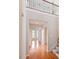Grand foyer with hardwood floors, arched doorways, and staircase to the second floor at 1324 Vanagrif Ct, Wake Forest, NC 27587