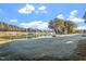 Scenic view of the golf course with a lake, showcasing the beautiful landscape and serene water features at 1324 Vanagrif Ct, Wake Forest, NC 27587