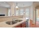 Well-appointed kitchen featuring stainless steel appliances, stone countertops, and ample counter space for meal preparation at 1324 Vanagrif Ct, Wake Forest, NC 27587