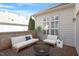 Stylish outdoor patio with a cozy seating area and brick paving, perfect for entertaining or relaxing by the fire pit at 1324 Vanagrif Ct, Wake Forest, NC 27587