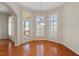 Inviting sunroom features many windows, hardwood floors, and access to the backyard at 1324 Vanagrif Ct, Wake Forest, NC 27587