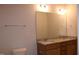 Bathroom featuring double sink vanity, granite countertop and decorative lighting at 141 Rolesville Ridge Drive Dr, Rolesville, NC 27571